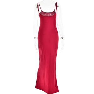 Rear view of sleek red backless maxi dress with thin straps on a mannequin
