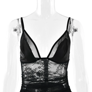 Close-up of black floral lace and sheer mesh patchwork on a deep V-neck bodysuit