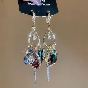 Vintage French gold tassel earrings with glittering crystal drop pendants and luxury style