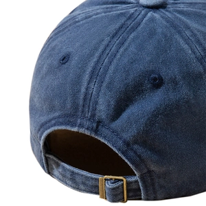 Adjustable washed navy blue baseball cap with metal buckle closure and vintage texture