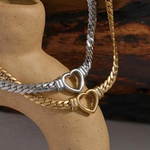 Elegant gold and silver heart pendant necklaces with bold cuban link chains for women