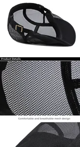 Detail view of black breathable mesh beret with side metal adjustment buckle