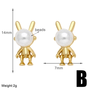 Détail de boucles d'oreilles lapin robot doré avec perles blanches, 14mm sur 7mm