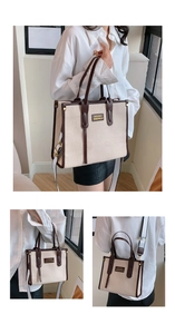 Lifestyle view of large beige canvas tote bag with brown leather trim in use