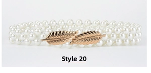 Close-up of three-row pearl belt with elegant gold leaf buckle for women's dresses