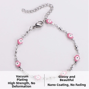 Detail of pink Hamsa hand charms and evil eye beads on polished stainless steel chain