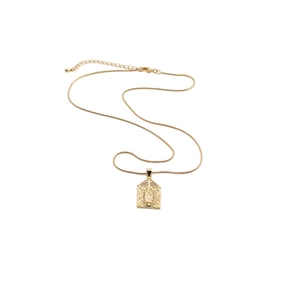 Detail of gold snake chain necklace with religious saint pendant and zircon accents