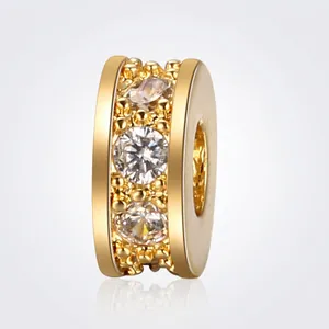 Macro view of gold-plated spacer bead with micro-paved white zircon for DIY jewelry