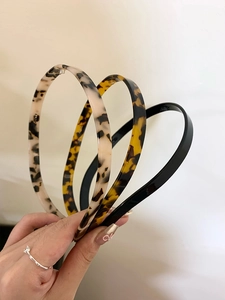 Three-piece acrylic headband set in leopard print and black for hair styling