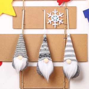 Three-piece knitted Christmas gnome hanging ornaments with snowflake patterns and white beards