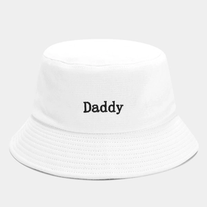 Close-up of Daddy embroidery on a white cotton bucket hat with detailed stitching