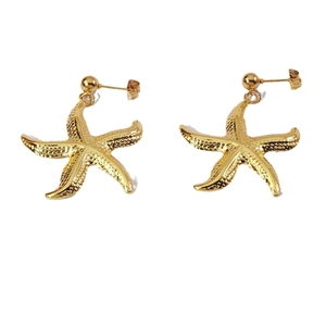 Golden starfish stud earrings with realistic textured metal finish on white background