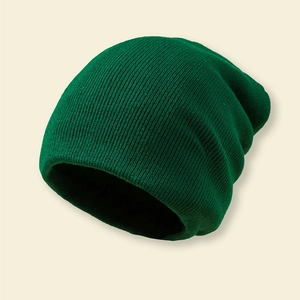 Close-up of dark green knitted beanie with vertical ribbed texture for winter warmth