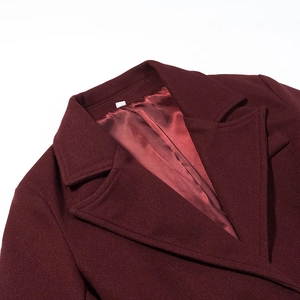 Detailed close-up of wine red wool coat collar featuring premium glossy satin lining