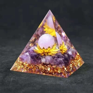 Detail of Orgone Pyramid with amethyst stones gold foil and lotus resin ornament