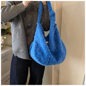 Blue fuzzy wool shoulder bag featuring a unique knotted strap and large capacity