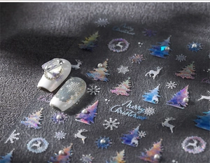 Detail of Christmas nail stickers with laser deer, snowflake patterns and 3D pearls