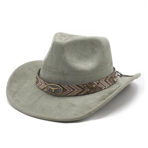Detail of olive green suede cowboy hat with ethnic band and metal bull head emblem