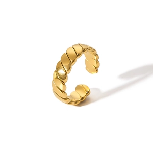 Close-up of golden twist texture and C-shape open design on the stainless steel ring
