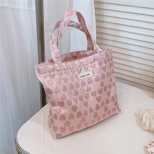 Detail of pink heart jacquard fabric and simple wish label on the sweet tote bag