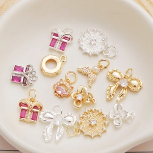 Selection of 14K gold-plated clover and mermaid tail charms with zircon stones