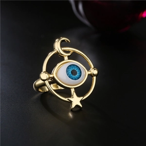 Golden evil eye open ring featuring mystical celestial moon and star elements