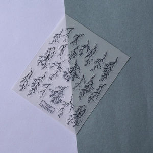Detailed macro view of 5D black thunderbolt pattern nail stickers with embossed texture