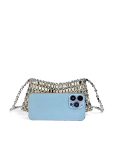 Detail of hand-woven silver sequin mini crossbody bag showing metallic bead textures