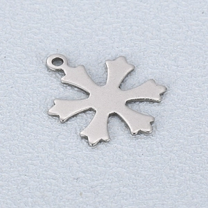 Macro view of silver snowflake pendant with polished finish for necklace DIY projects