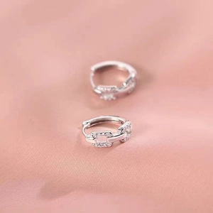 Elegant 925 silver geometric chain earrings with sparkling cubic zirconia on pink silk