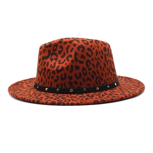 Detail of leopard print wide brim fedora with gold and silver metallic stud ribbon