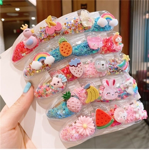 Close-up of clear fruit hair clips with glitter sequins and cute silicone cartoon charms