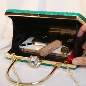 Green pleated satin evening clutch bag with gold floral rhinestone clasp and chain strap
