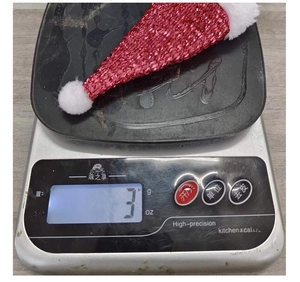 Mini Christmas hat cutlery holder showing ultra-lightweight 3g on a digital kitchen scale