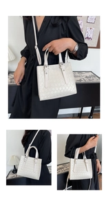 Chic woven texture white square handbag shown handheld and crossbody style in a room