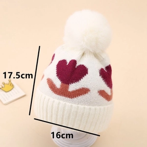 Detailed view of 17.5x16cm winter baby knit hat with floral print and white pom-pom