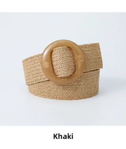 Detail of khaki bohemian woven straw belt with a vintage round resin buckle