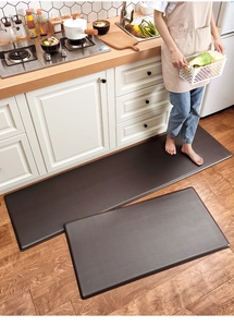 Close-up of non-slip brown kitchen mats with textured surface for fatigue relief