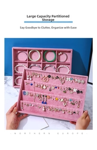 Close-up of pink velvet jewelry tray with 12 compartments and earring organizer slots