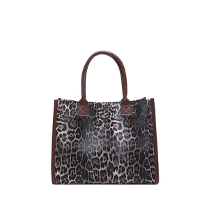 Stylish large leopard print tote bag with brown handles on a clean white background