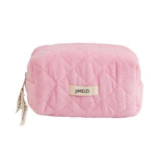 Pink quilted towel fabric makeup bag with top zipper and soft textures