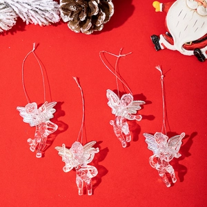 Set of four clear acrylic Christmas angel pendants on festive red background