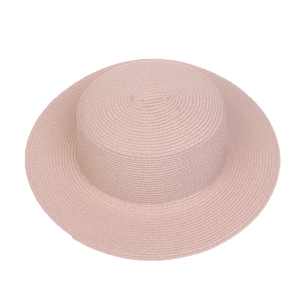 Top view of pink straw sun hat showing fine woven texture and wide flat brim design