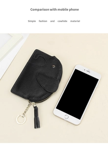 Size comparison of elephant leather coin purse next to a smartphone showing dimensions