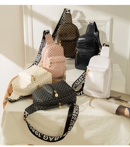 Close-up of stylish crossbody bags in various textures, colors and wide straps