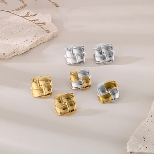 Detailed view of square braided texture stud earrings in gold, silver and mixed tones