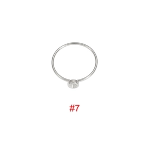 Detailed view of silver stainless steel ring base with a round bezel setting in size #7