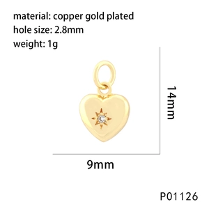 Macro view of 18K gold plated heart pendant with starburst cubic zirconia detail