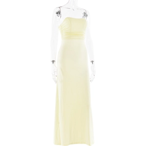 Detail view of light yellow strapless maxi dress with elegant pleats and ruched fabric texture