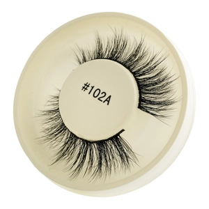 Detail of glue-free false eyelashes in black voluminous style on beige tray #102A